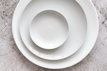 white color Plain dinner plate on stone table top view