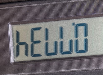 Old LCD calculator display upside down writing out a word hello