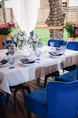 Empty glasses set in restaurant. Part of interior. Magic blue colors.