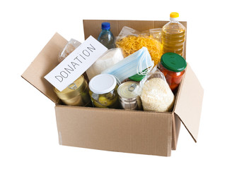 Cardboard box with oil, canned food, cereals and pasta.