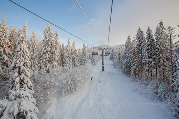 Ski lift in the snow mountains