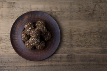 Oat and nut home made energy balls in a brown plate