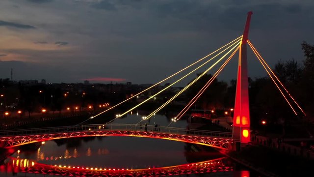 Park-Strelka on the embankment in Kharkov, Evening walking bridge. 4k aerial photography