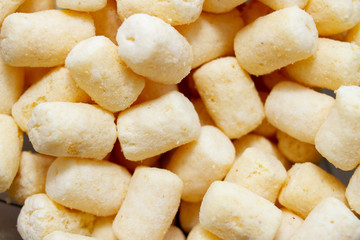 Close up of sweet yellow corn sticks. Food background