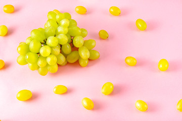 bunches of   grapes on a pink background top view