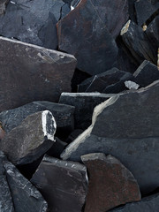 Dark Aged Shabby Cliff Face And Divided By Huge Cracks And Layers. Coarse, Rough Gray Stone Or Rock Texture Of Mountains, Background And Copy Space For Text Rock Shelf for a Product Display