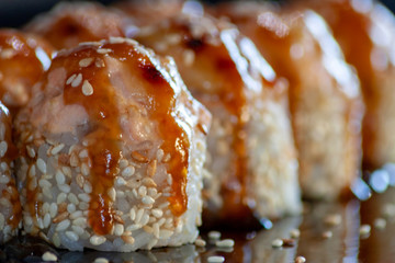 Set of baked sushi with tuna and unagi sauce