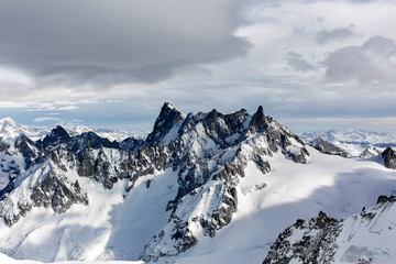 Fototapeta na wymiar Snowy mountain peaks in French Alps