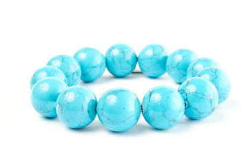 aventurine from turquoise semiprecious stone on a white background. close up