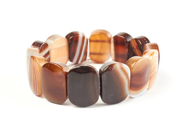 bracelet from a carnelian semiprecious stone on a white background. close up