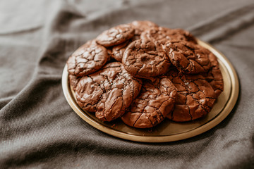 Tasty chocolate brownie cookies on paper