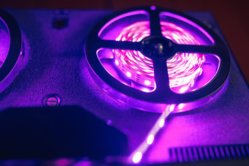 reel to reel audio tape recorder with purple led light strip
