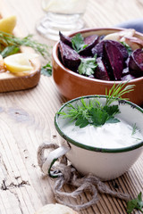Healthy vegetarian meal, fresh Greek yoghurt with herbs, baked beetroot