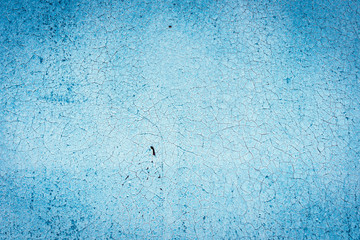 Texture of a rusty metal surface: dark blue, blue, aged cracked paint. Background of old painted sheet metal with rust painted in blue.