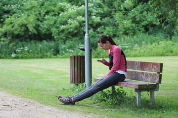 Watching phone in park