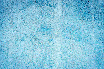 Fototapeta na wymiar Texture of a rusty metal surface: dark blue, blue, aged cracked paint. Background of old painted sheet metal with rust painted in blue.