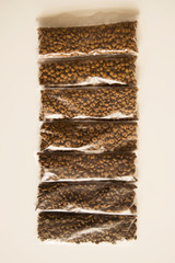 Seven types of different animal feeds are arranged in one strip along the gradient of colors.