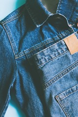 Blue denim jacket and jeans flat lay photography. Summer trendy outfit
