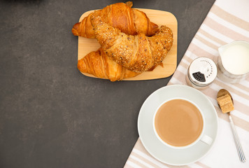 Breakfast Served in the morning with Hot black coffee and croissants Natural corn flake breakfast cereal in cups and fruit on the breakfast table every day