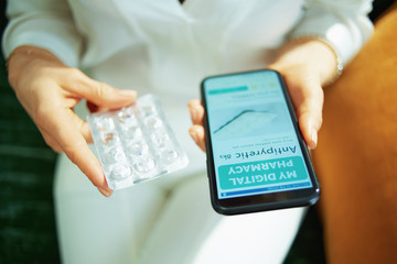 woman buying pharma in living room in sunny day