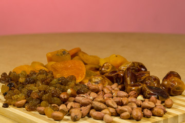 background of mixture of nuts and raisins, closeup