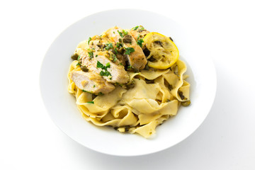 Chicken piccata with sauce, lemon and capers