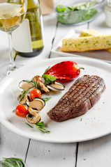Beef steak with vegetables and mustard sauce