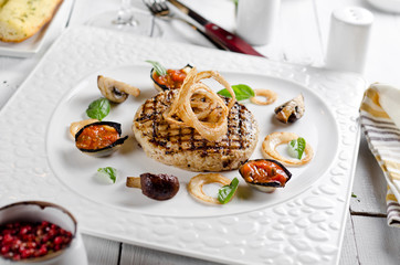 Veal cotoletta with baked vegetables