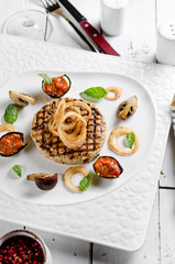 Veal cotoletta with baked vegetables