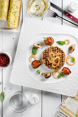 Veal cotoletta with baked vegetables