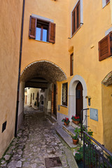 Fototapeta na wymiar A narrow street in the medieval town of Itri, in the province of Latina