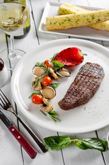 Beef steak with vegetables and mustard sauce
