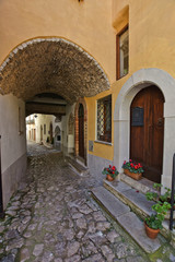 Fototapeta na wymiar A narrow street in the medieval town of Itri, in the province of Latina