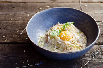 Carbonara pasta with bacon, cream sauce, Parmesan cheese and egg yolk. Traditional italian food.