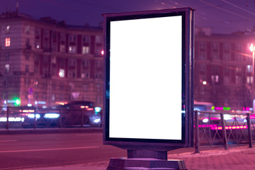 Advertising billboard vertical lightbox in the city glows at night