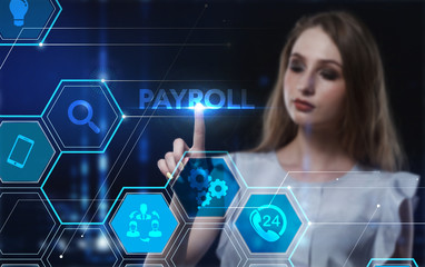 Business, Technology, Internet and network concept. Young businessman working on a virtual screen of the future and sees the inscription: Payroll