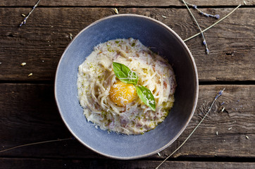 Carbonara pasta with bacon, cream sauce, Parmesan cheese and egg yolk. Traditional italian food.
