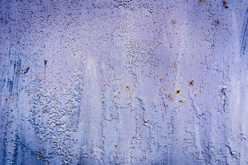 Texture of a rusty metal surface: dark blue, blue, aged cracked paint. Background of old painted sheet metal with rust painted in blue.