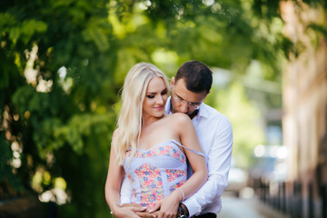 Naklejka premium woman with her husband walking around the city, dressed neatly