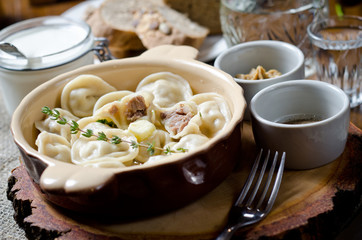 Boiled dumplings. Traditional meat dish of Russian cuisine
