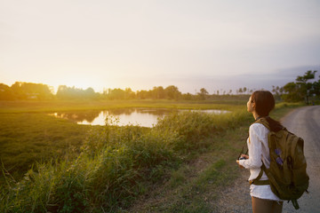 Women carrying cameras and bags ready to travel