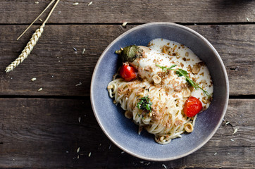 Pasta with eggplant, hazelnuts, pine nuts and cream sauce