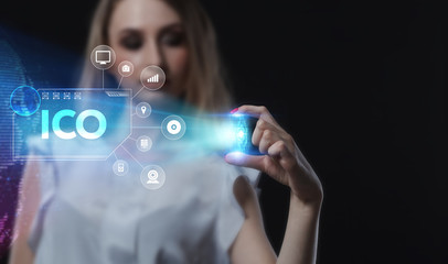 Business, Technology, Internet and network concept. Young businessman working on a virtual screen of the future and sees the inscription: ICO