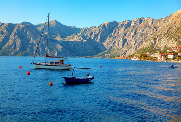 yacht and fishing boat at the Kotor Bay 