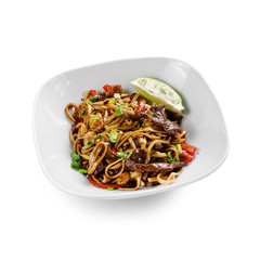 Fried udon noodles in a wok with beef, bell pepper and broccoli. Traditional asian food. Isolated on a white background.