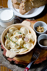 Boiled dumplings. Traditional meat dish of Russian cuisine