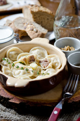 Boiled dumplings. Traditional meat dish of Russian cuisine