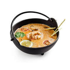 Soup Tom Yam. Thai spicy soup with shrimp and other seafood on a white background