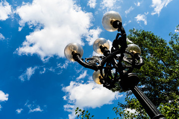 Cast-iron lantern in the summer Park