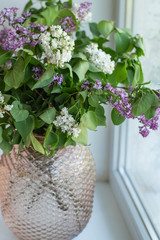 lilac bouquet on the windowsill at home